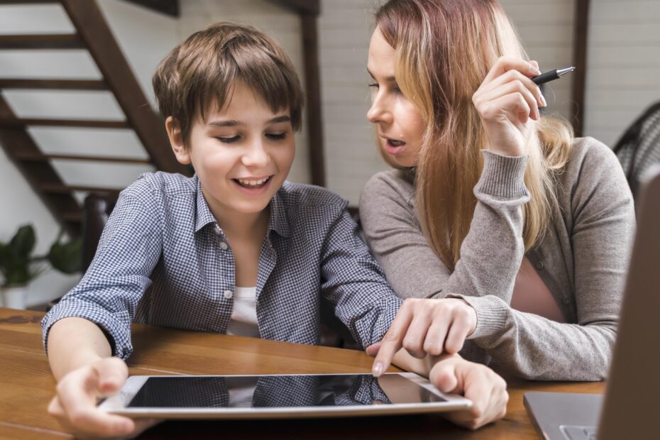 A homeschool mother and a child happily focus on a tablet, suggesting engagement in learning. Text below reads, "Using AI in Homeschooling: A Practical Guide for Parents."
