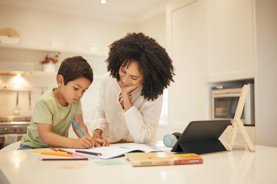 A woman helps a young boy with schoolwork at a table with a tablet and notebooks. Text reads: “The Secret Tool Every Student Needs for the Digital SAT: MindPrint.”.