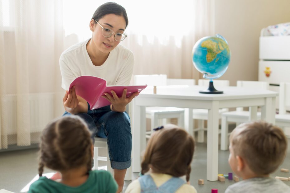 A microschool teacher sits in a classroom reading to students. Text Reads "Federal Education Freedom Tax Credit Could Impact Microschools" on red backround. Logo reads "Homeschool Boss"