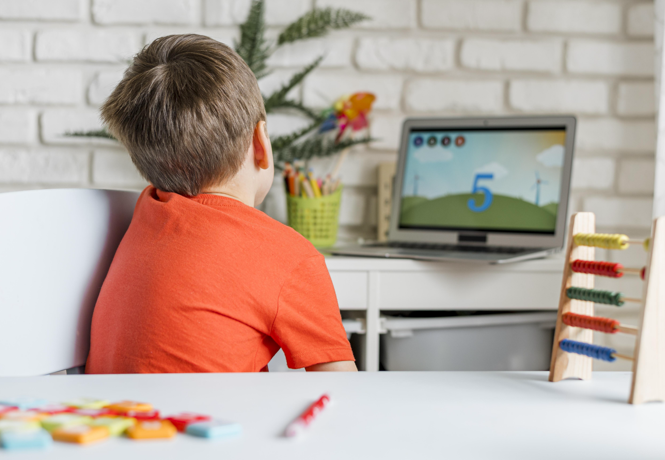 Young child watches i-Ready